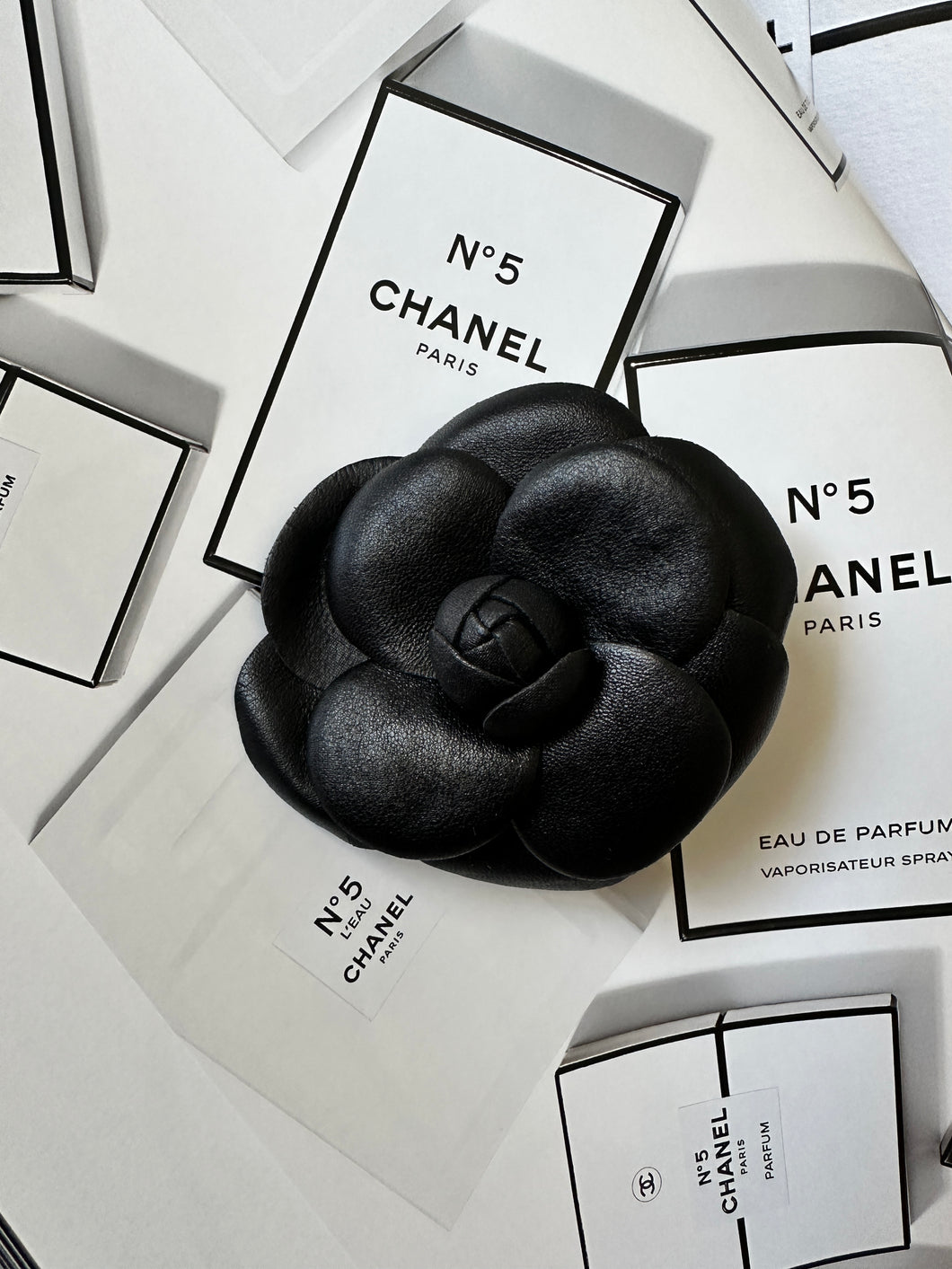 Chanel - Camelia Leather brooch